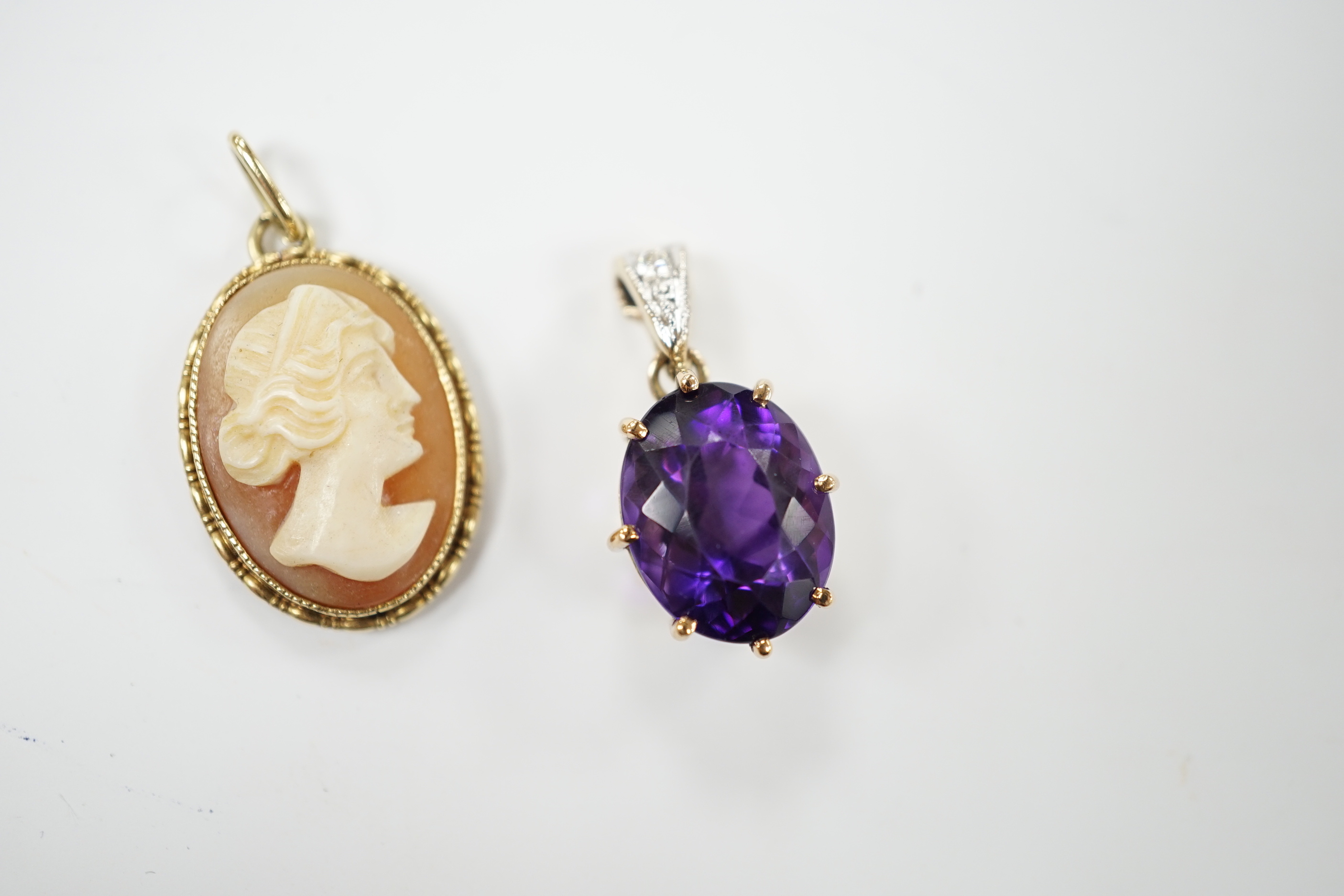 A yellow metal amethyst and diamond set pendant, 2cm, and a cameo pendant, stamped 585